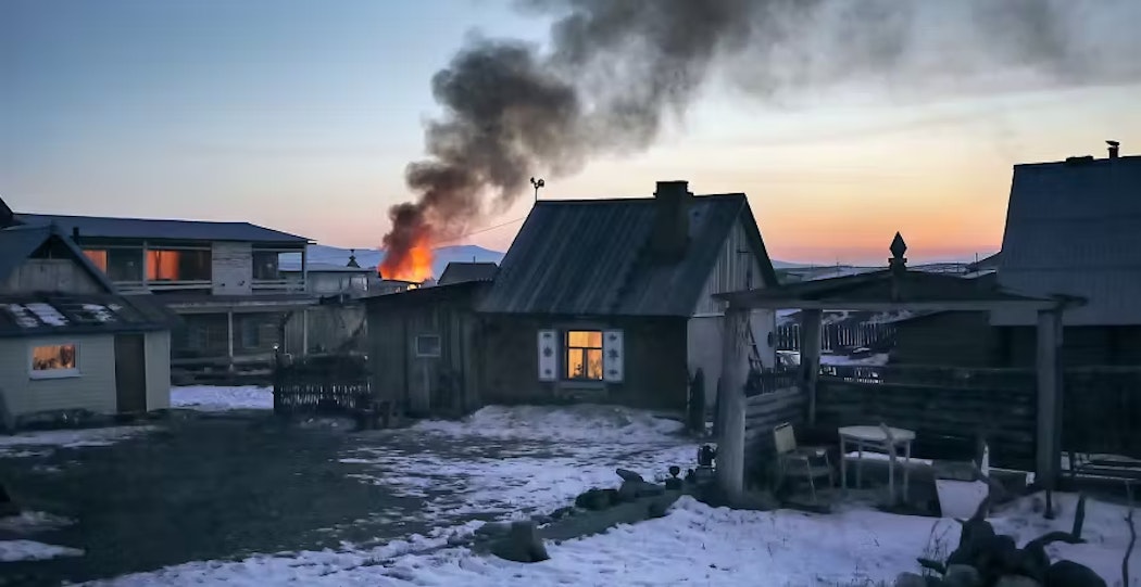 house on fire in snowy weather