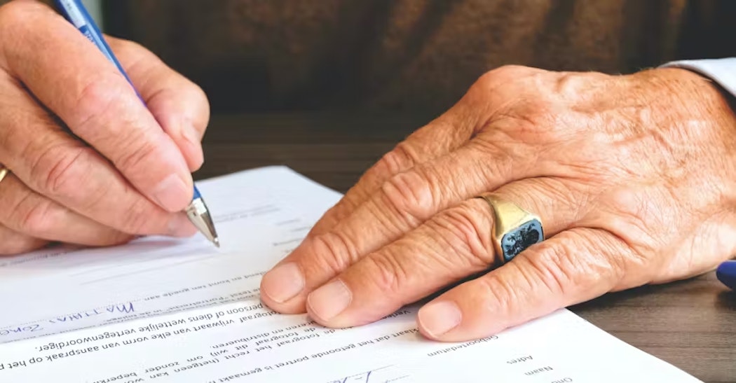 person signing papers