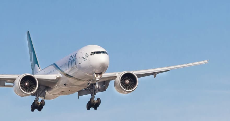 airplane flying in blue sky