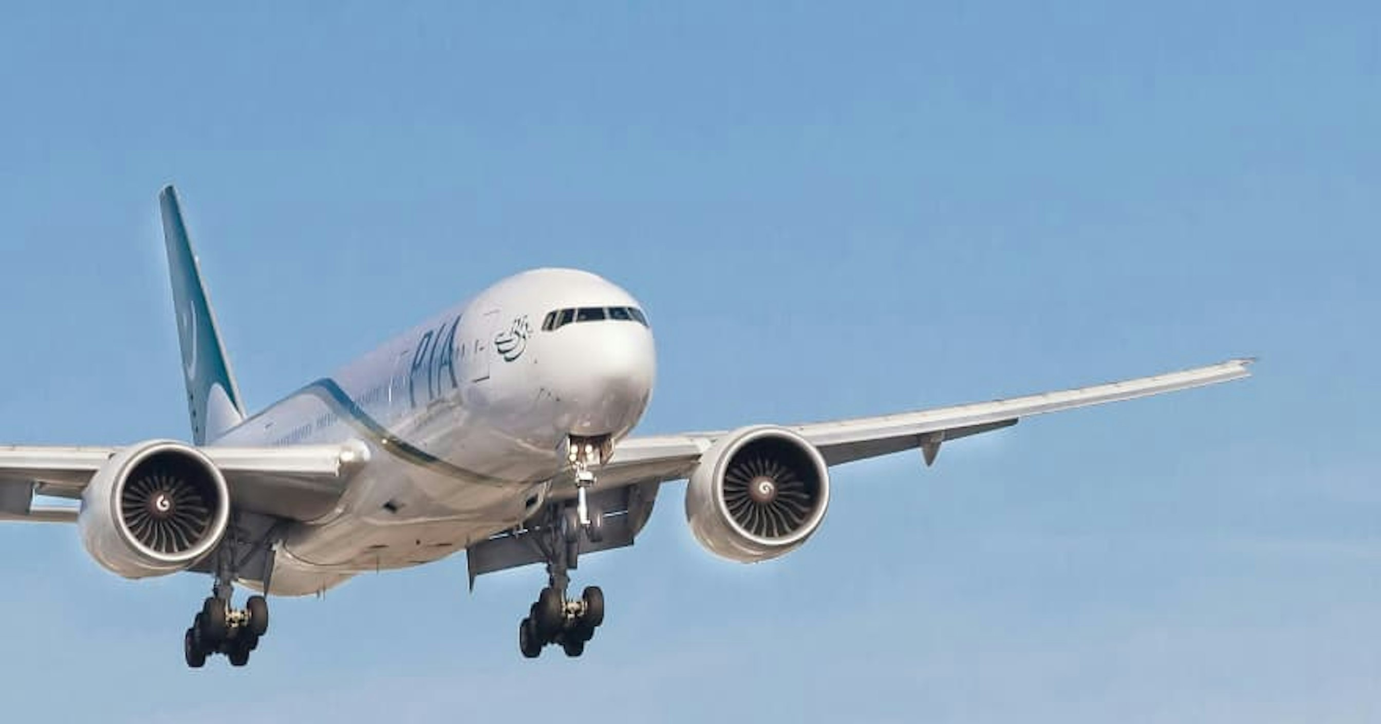airplane flying in blue sky