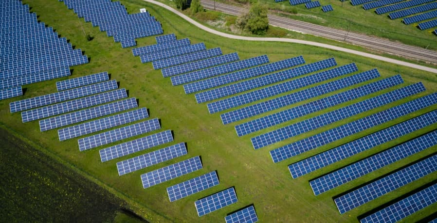 solar panels in green field