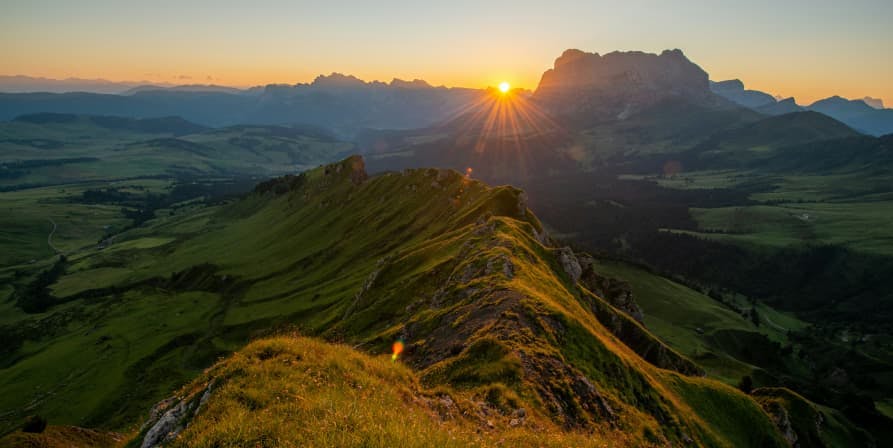 sun setting over a mountain