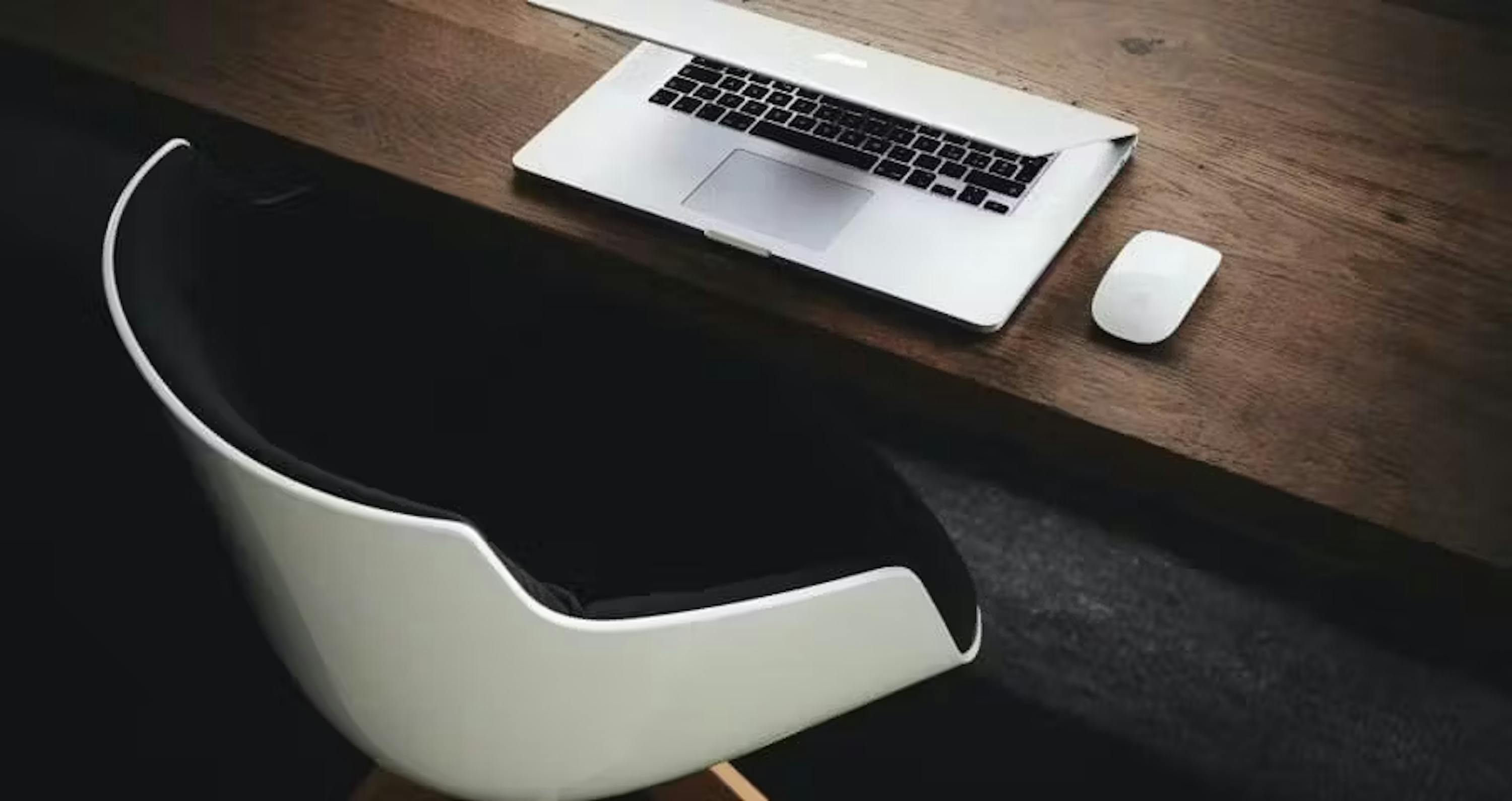 White chair and laptop on desk