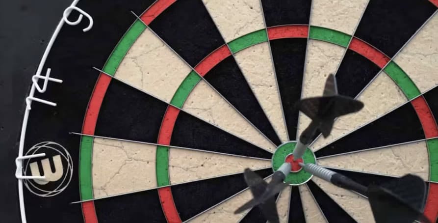 A close-up shot of a dartboard with darts on the bullseye