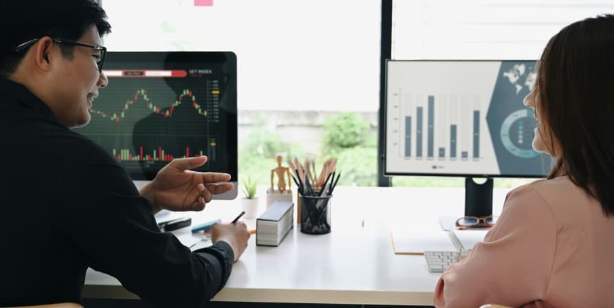 people discussing business plans at desk