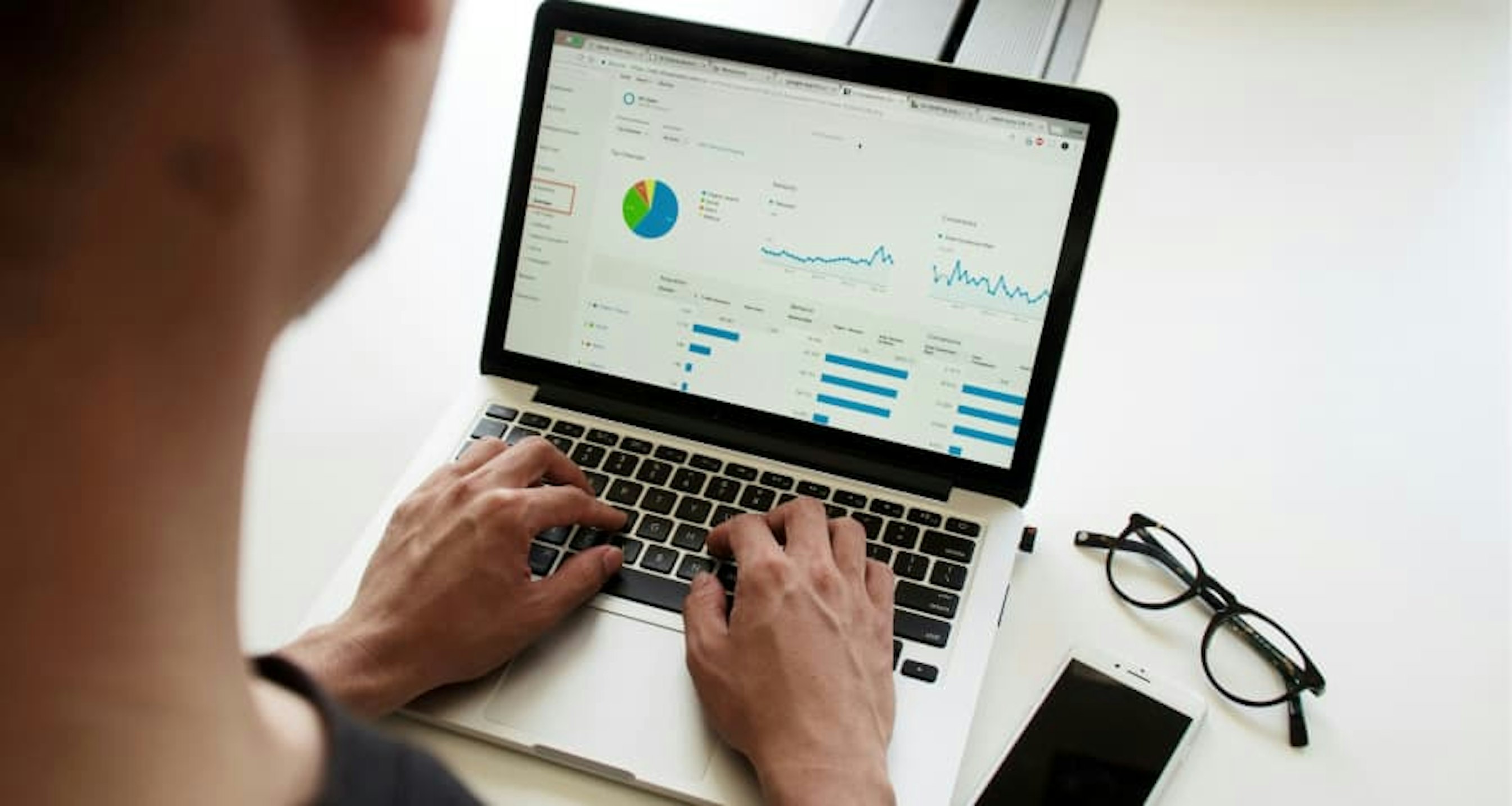 laptop open to data and graphs