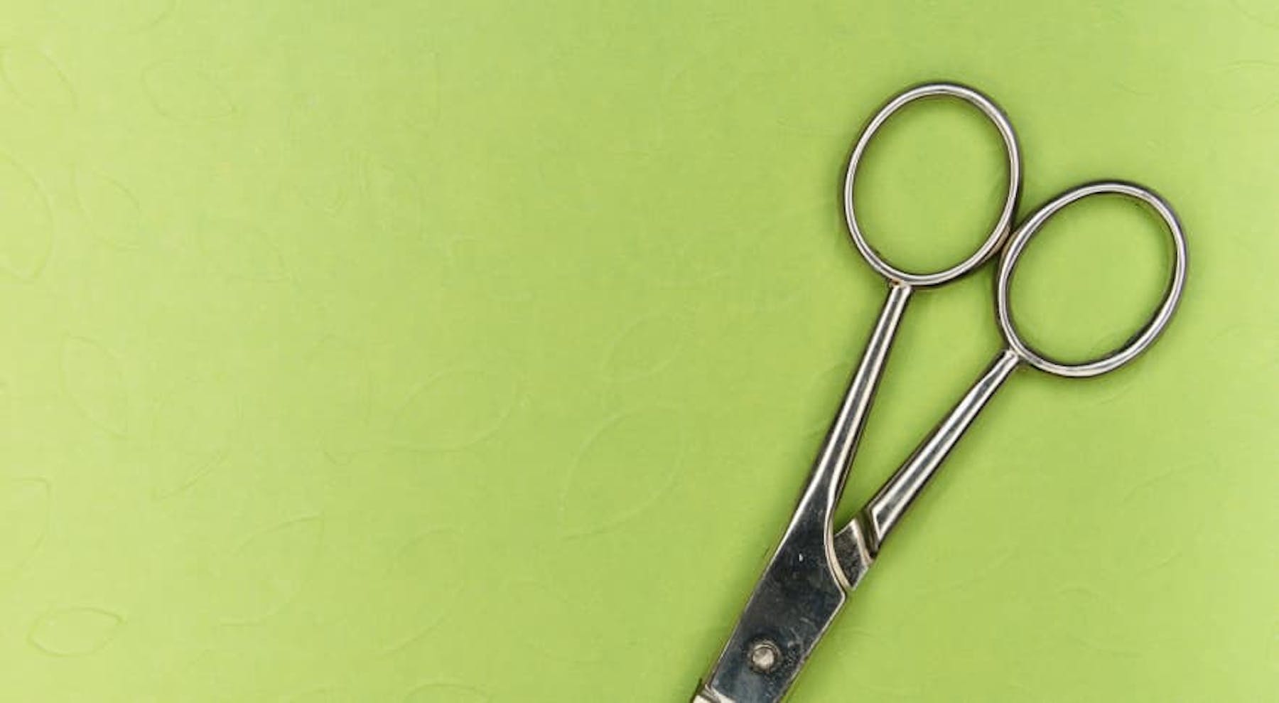scissors with green background