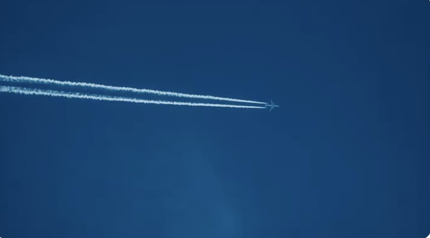 low angle photo of plane navy blue sky