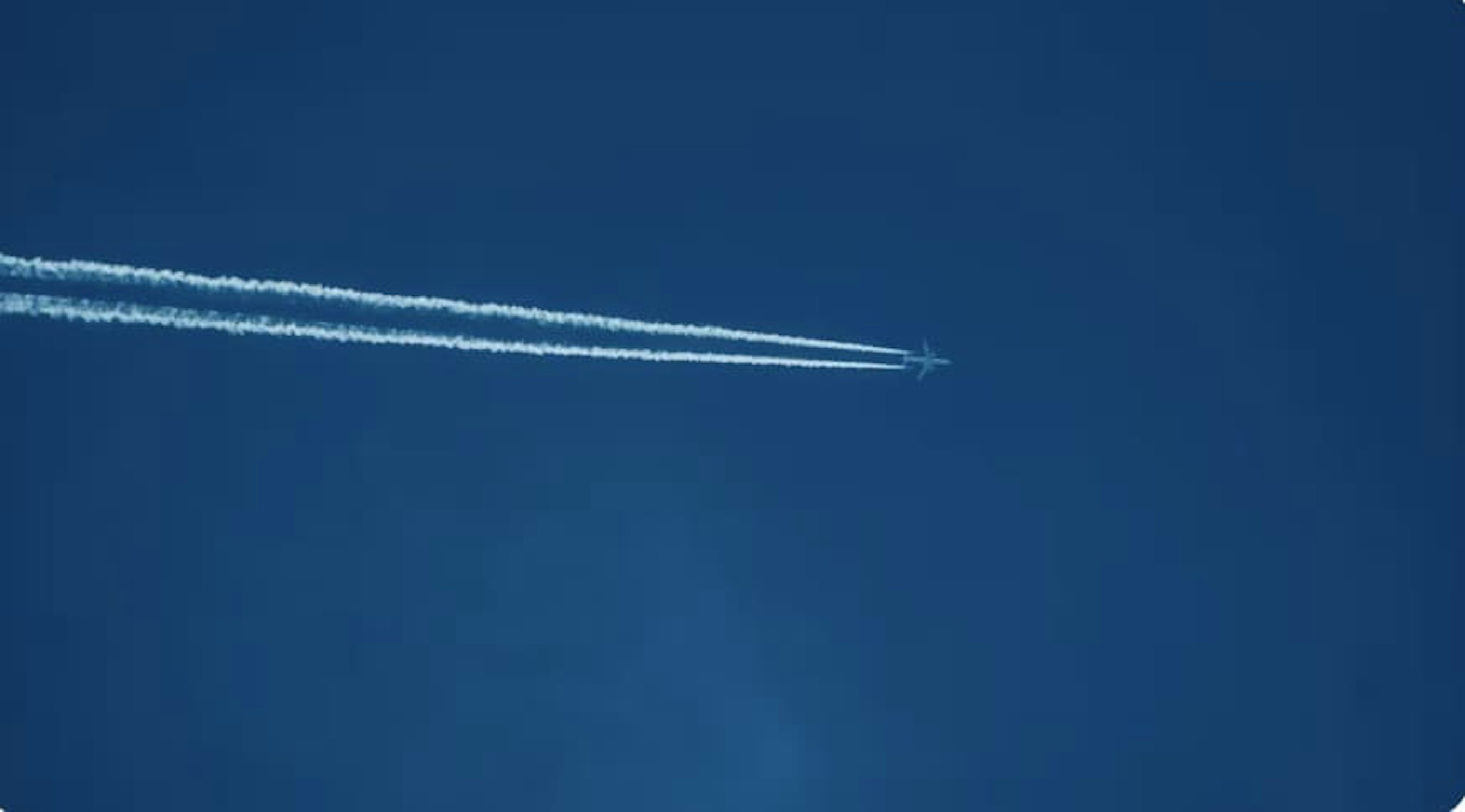 low angle photo of plane navy blue sky