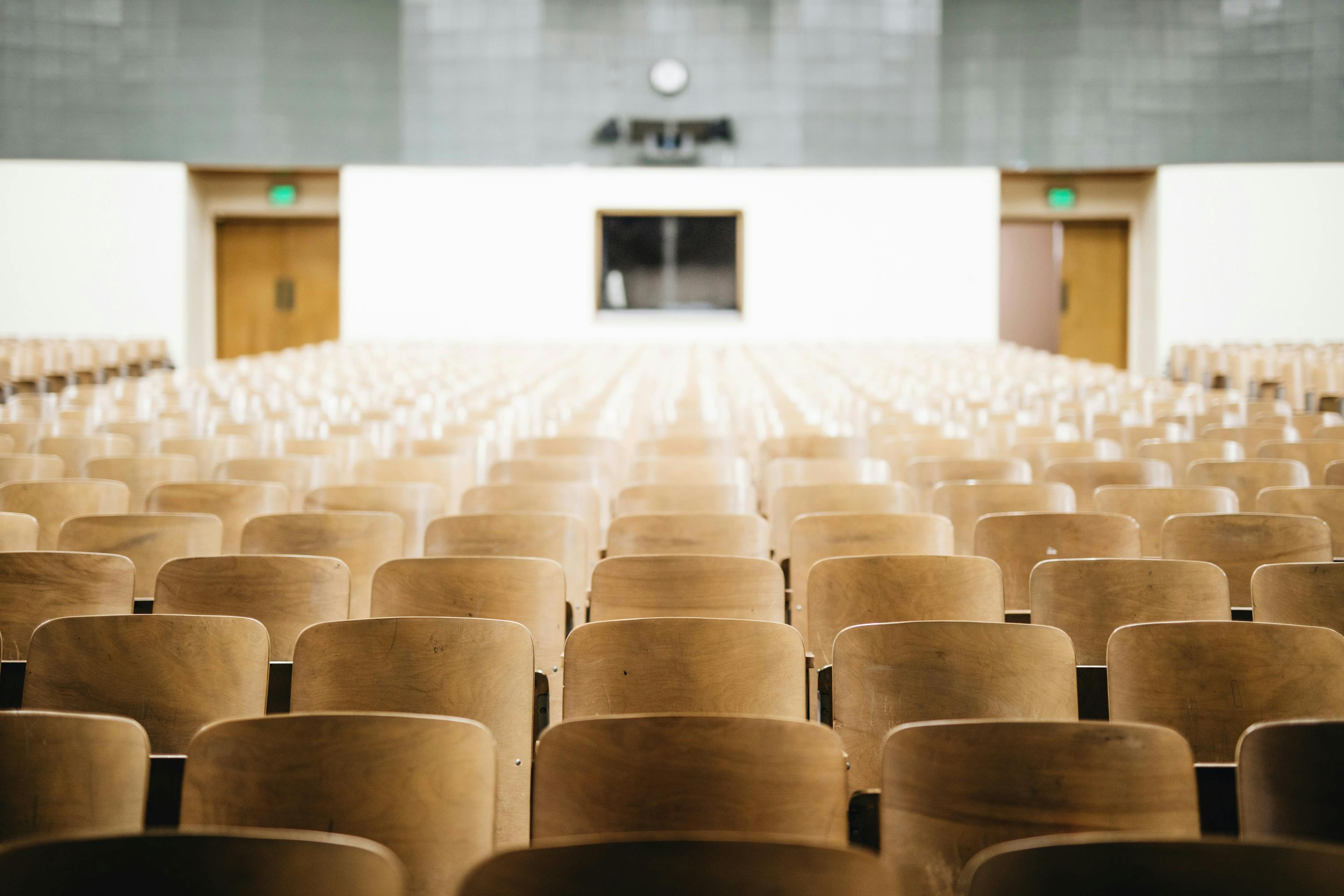 Empty chairs in a university classroom