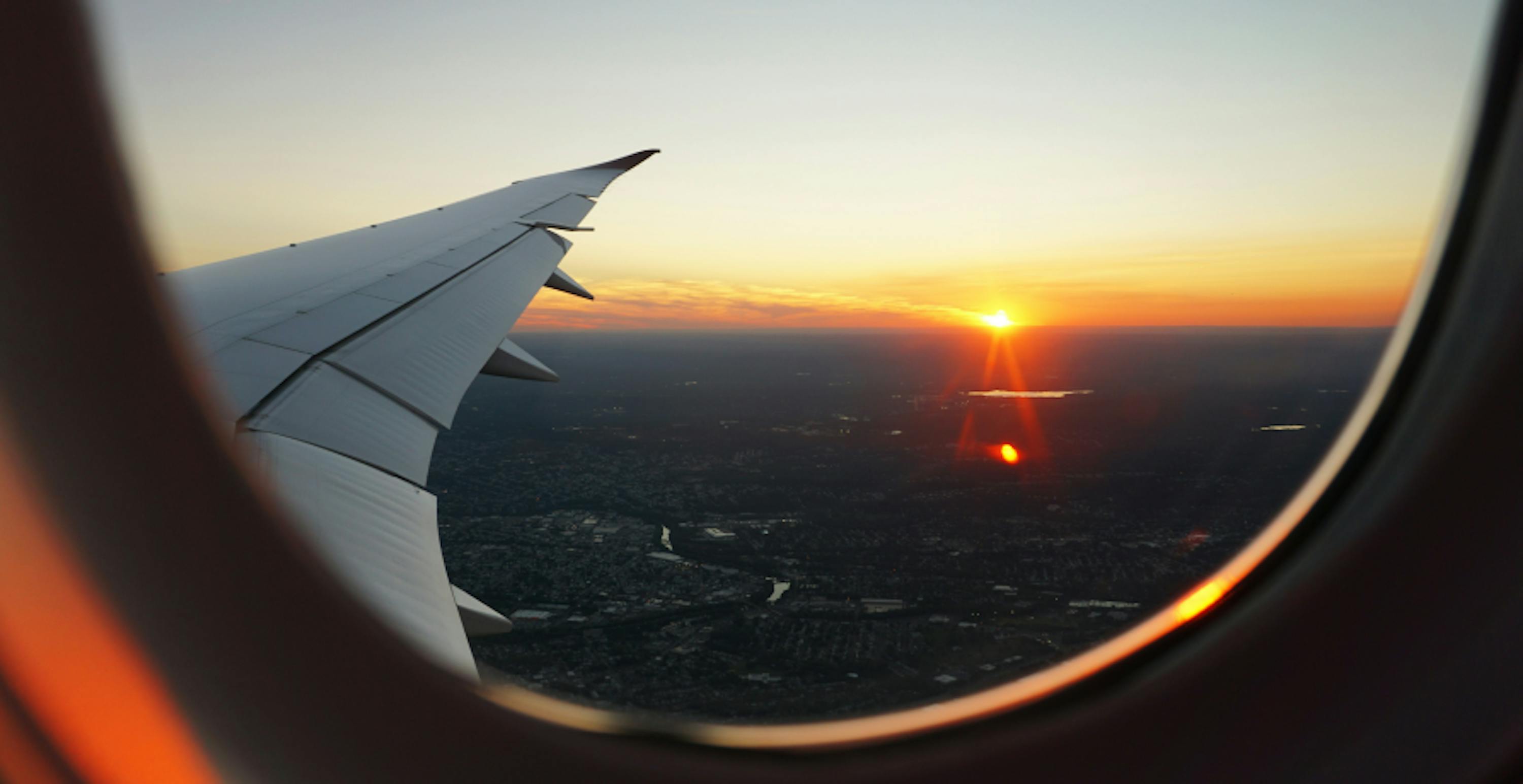 Wing of an airplane during sunset