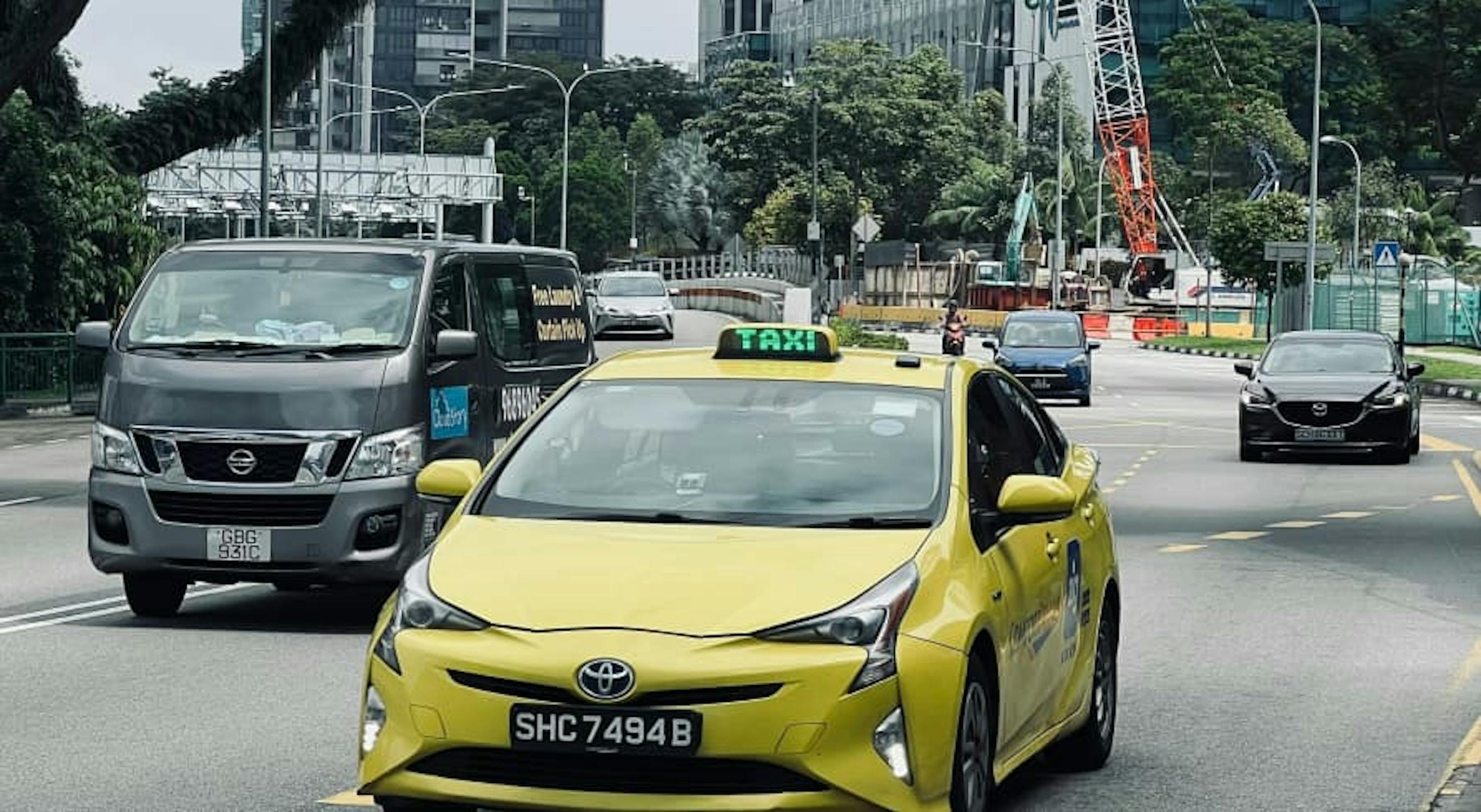 yellow toyota prius taxi