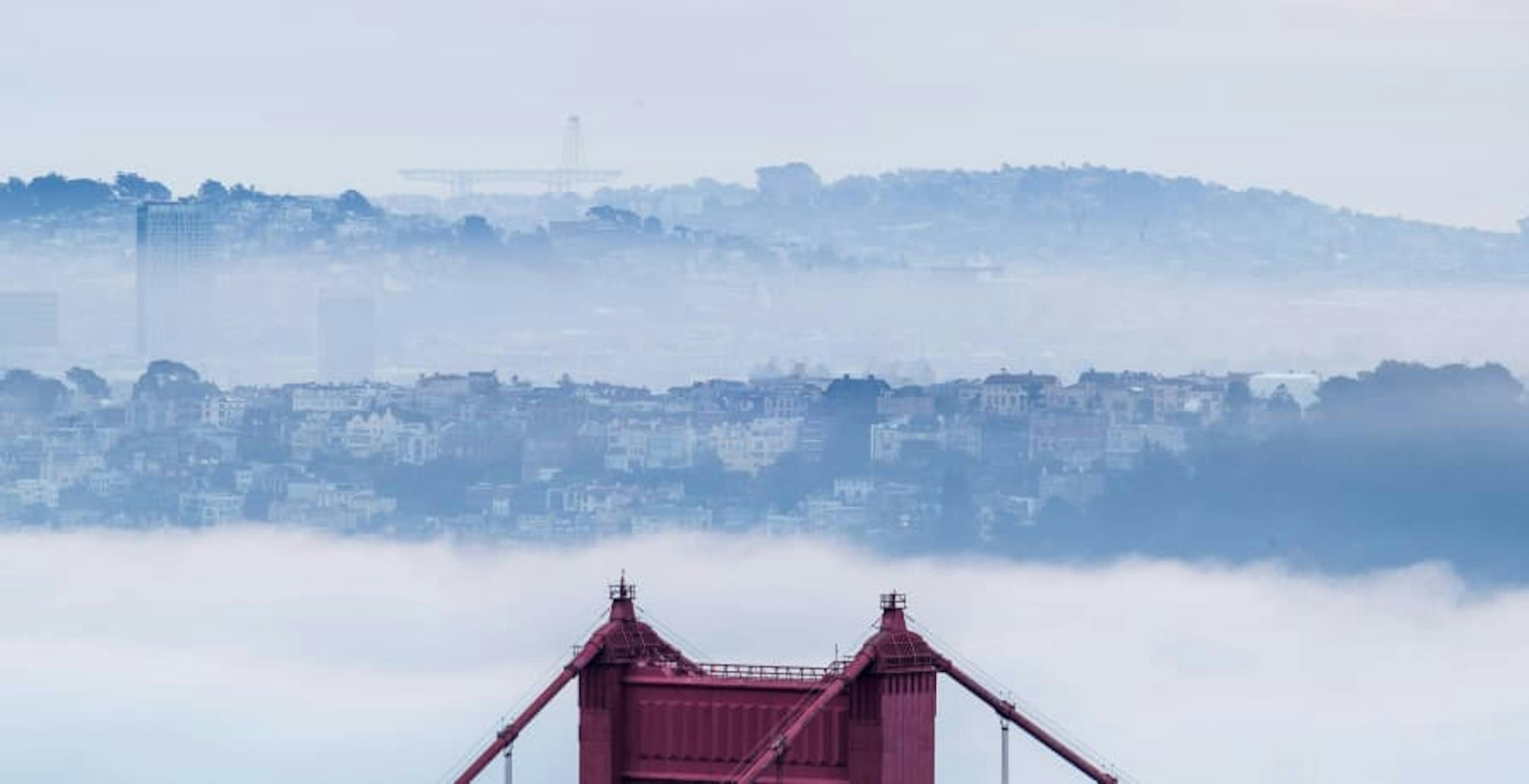 top of golden gate bridge with clouds