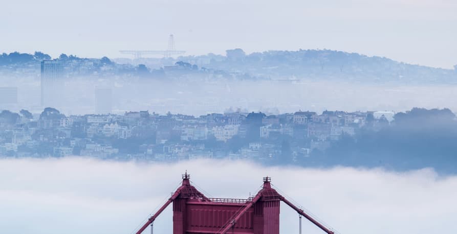 top of golden gate bridge with clouds