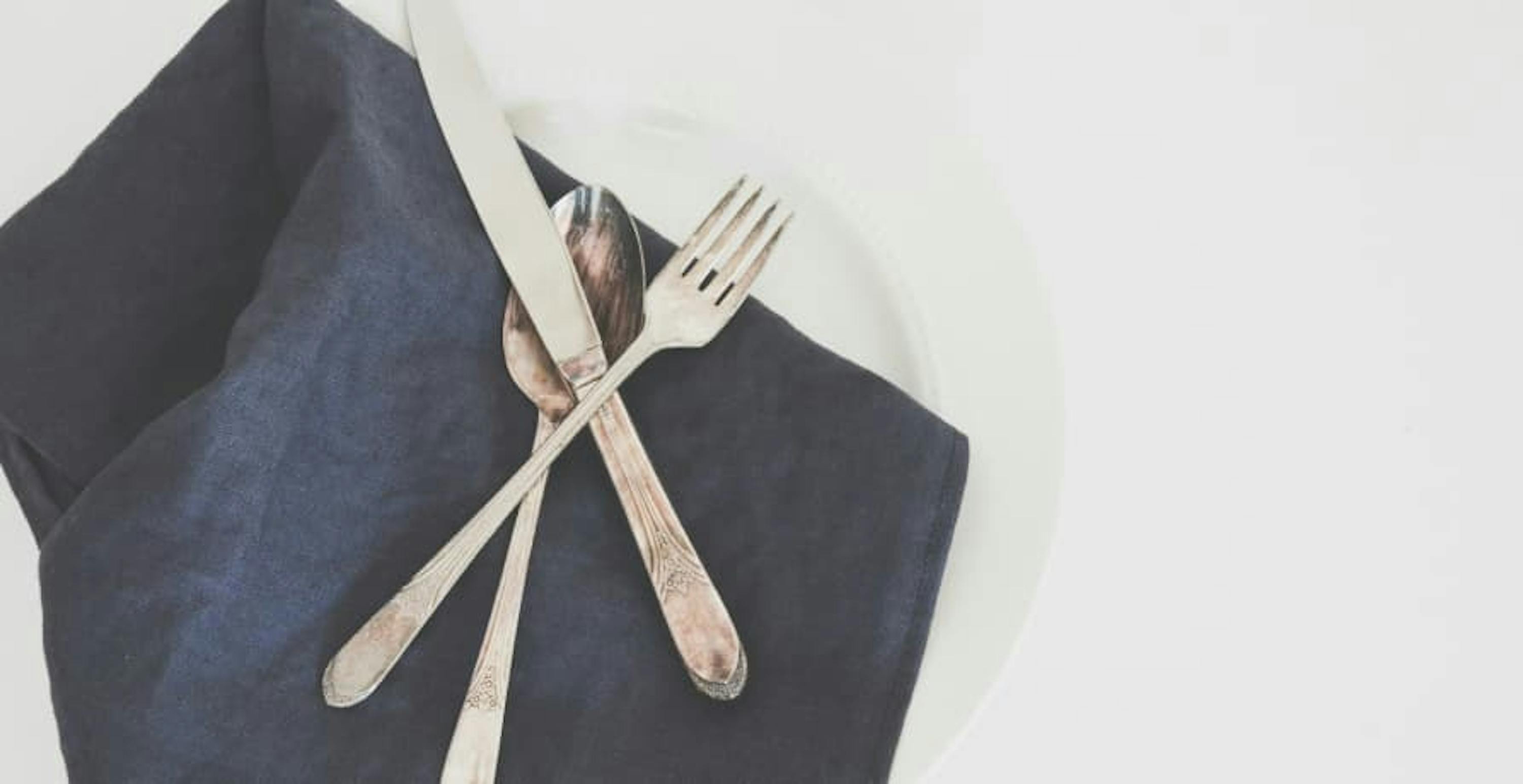 linen table cloth with silverware