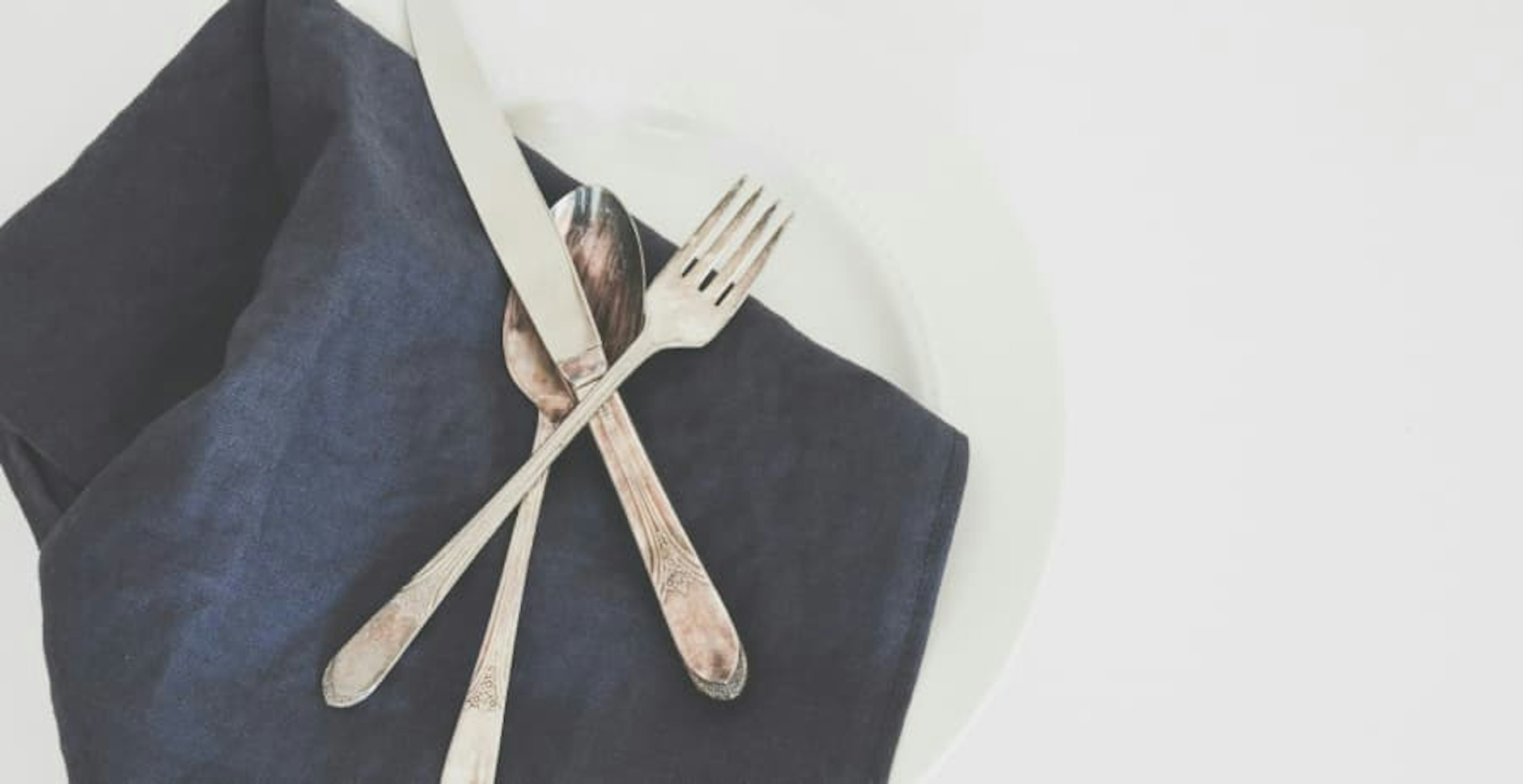 linen table cloth with silverware