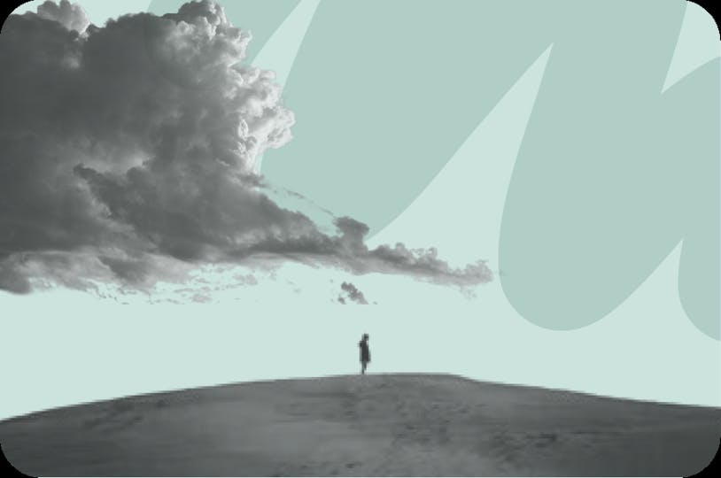 person standing on hill with clouds