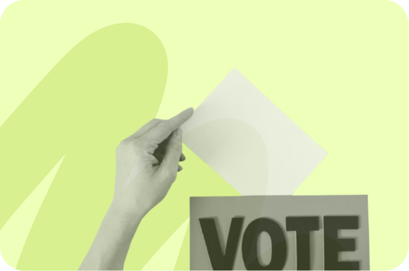 someone placing their ballot inside a box