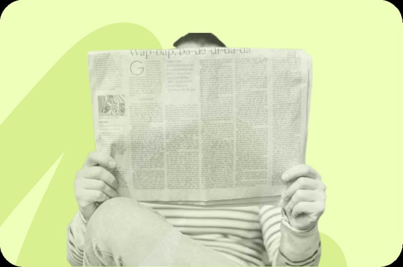 person reading newspaper