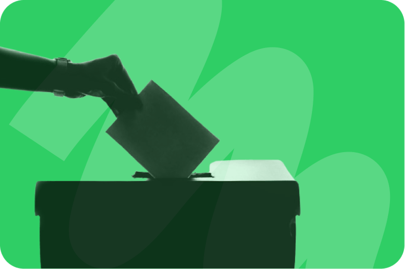 someone placing vote inside ballot box