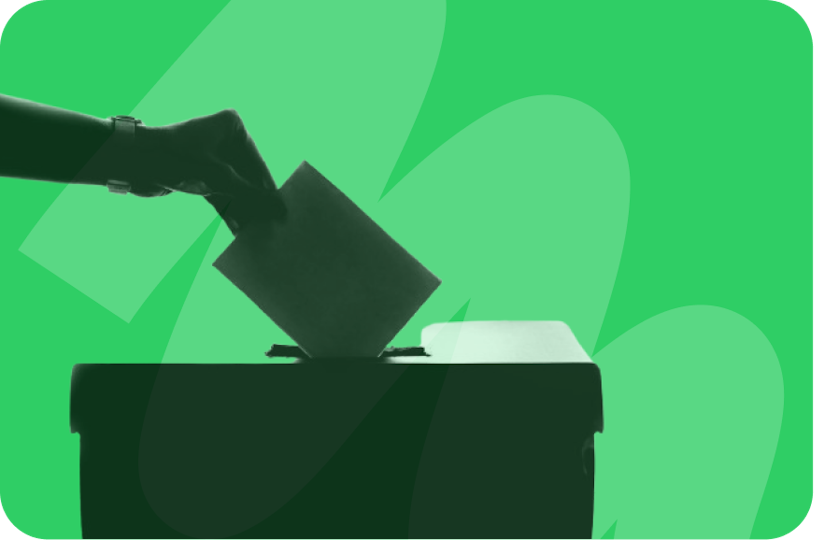 someone placing vote inside ballot box