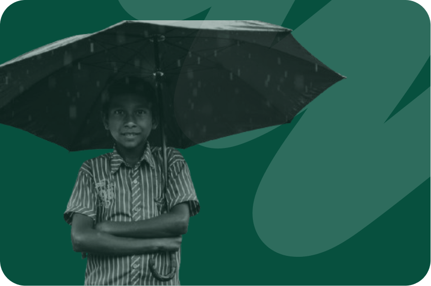 person standing in the rain with their umbrella