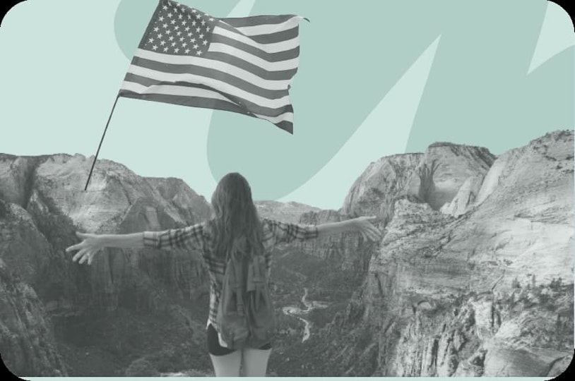 person with us flag overlooking canyon
