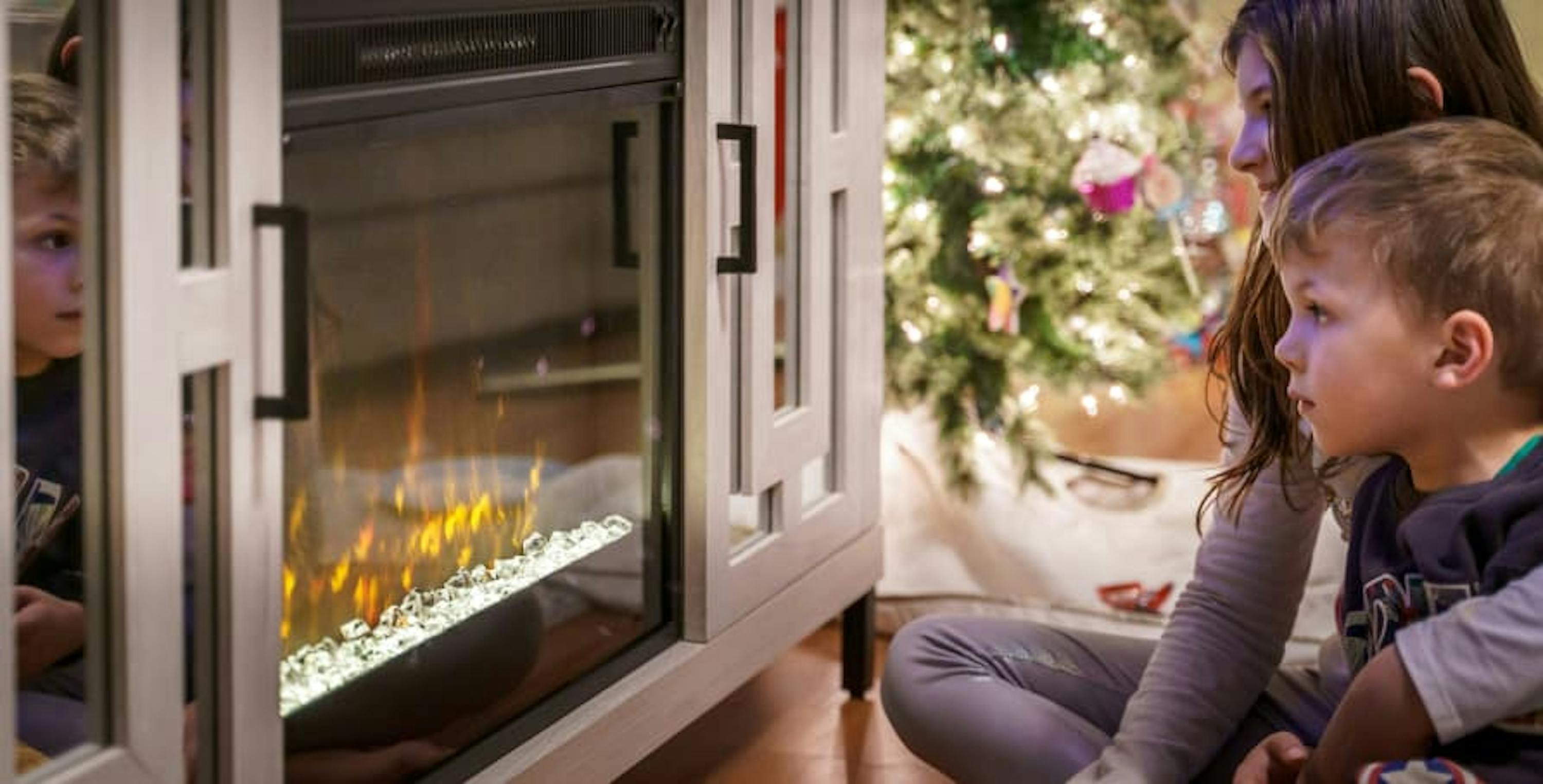 kids in front of a fireplace