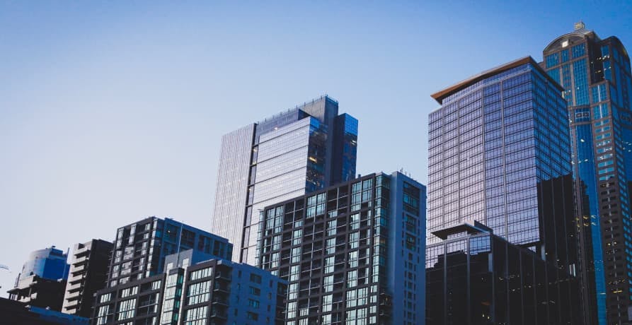 navy blue skyscrapers reflecting