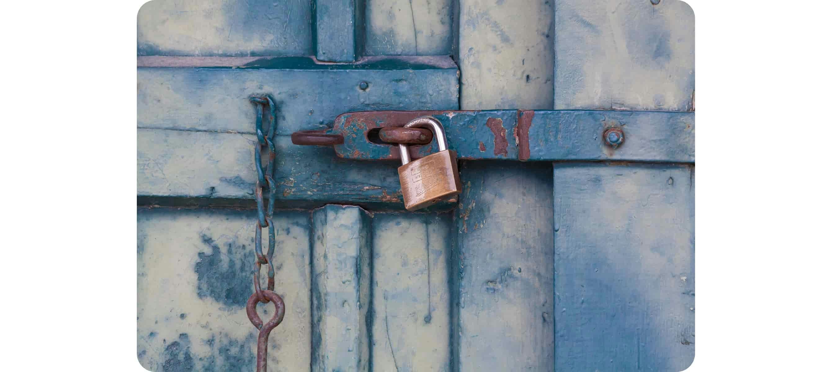 Golden padlock locking the door