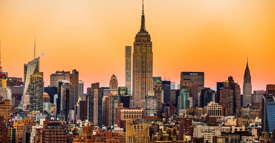 nyc skyline at sunset with empire state building