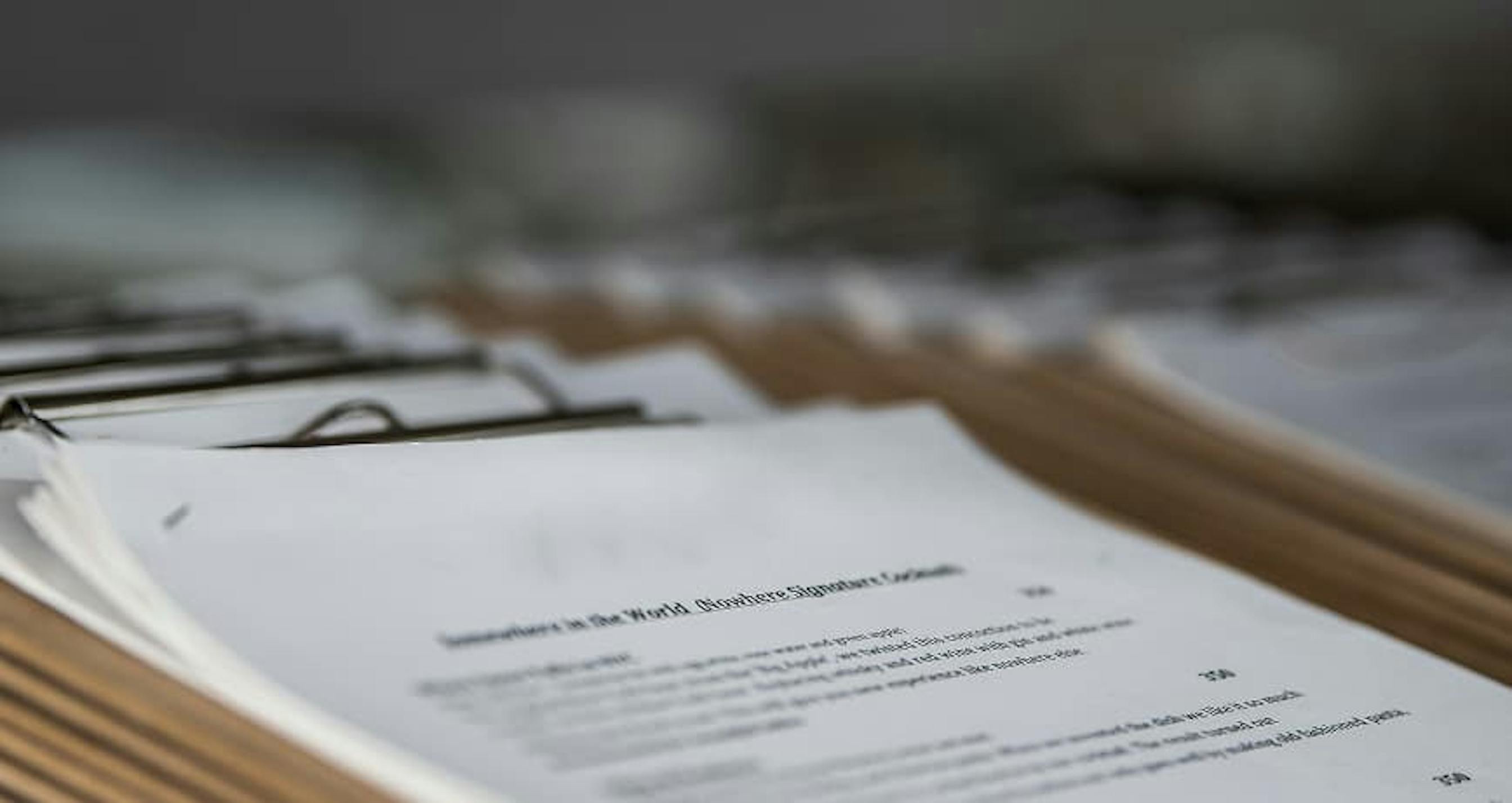 papers on clipboard