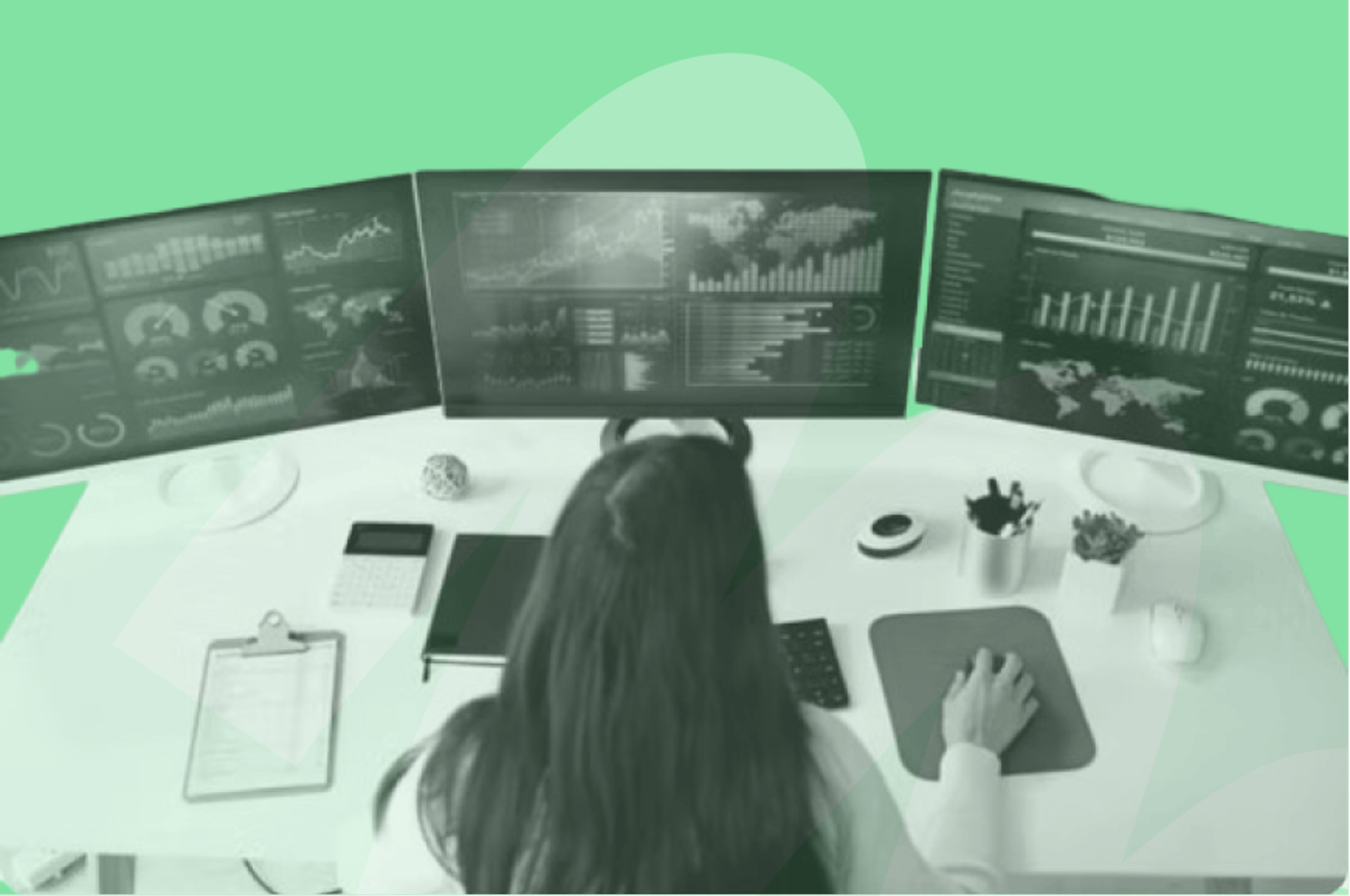 person looking at 3 monitors