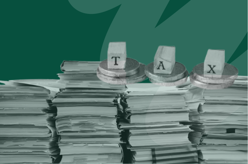 little scrabble cubes spelling out tax on tax papers