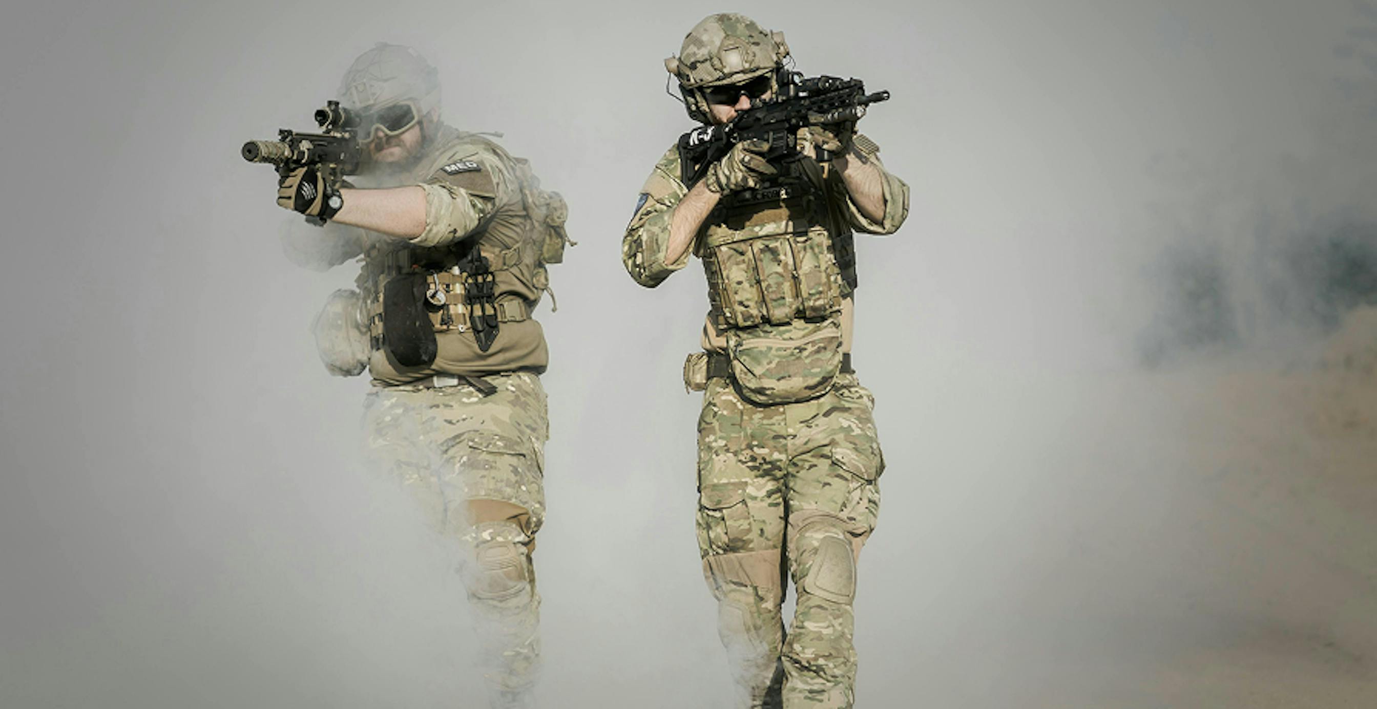 two soldiers in active combat