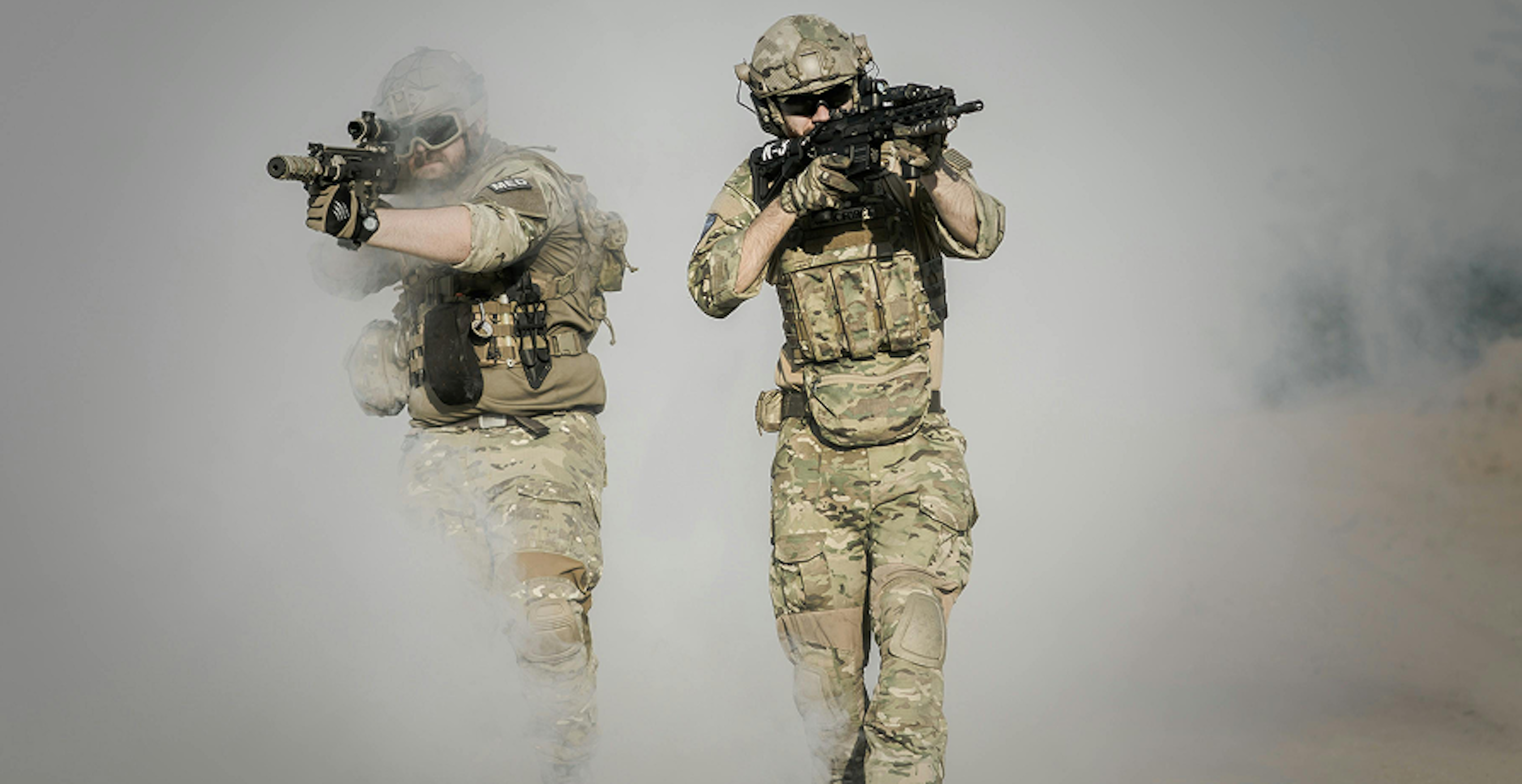 two soldiers in active combat