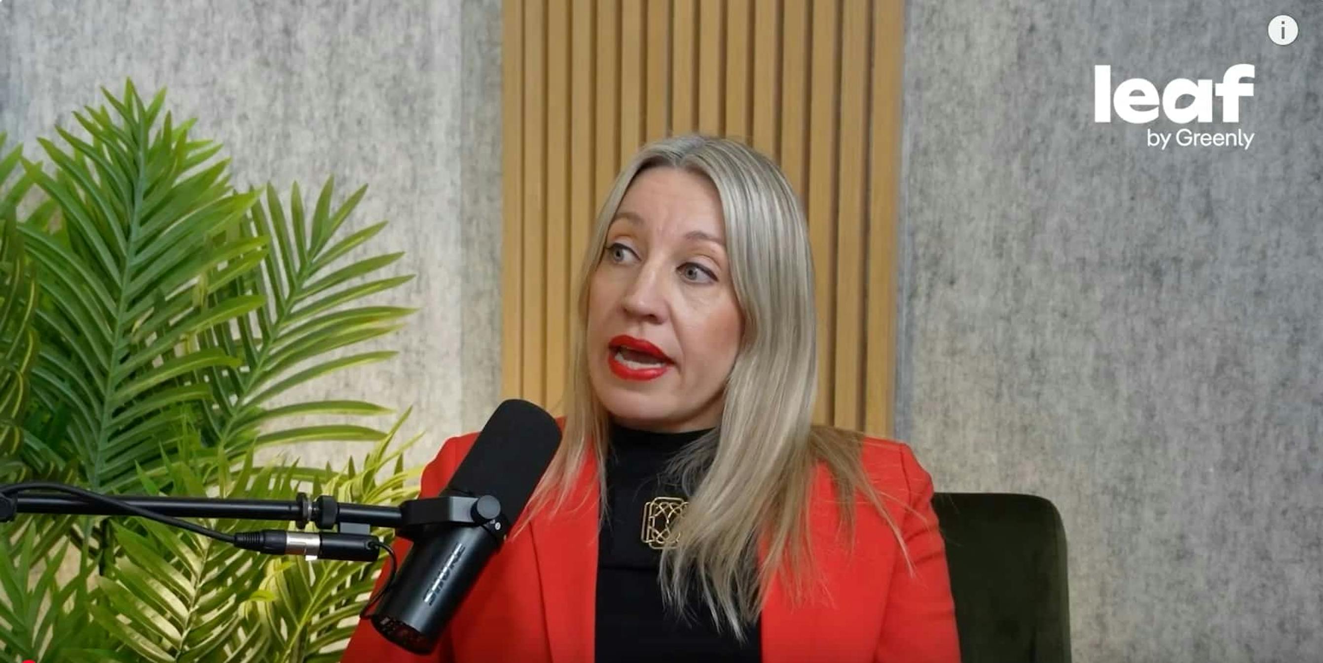 leaf media woman in red jacket blonde hair