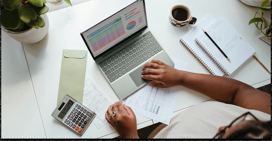 person working on a laptop bird's eye view