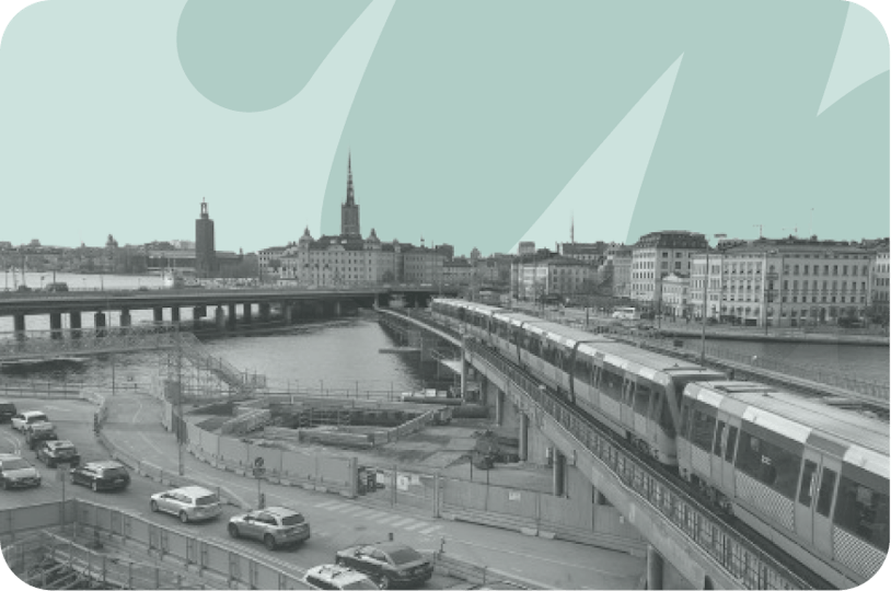 train and cars alongside one another