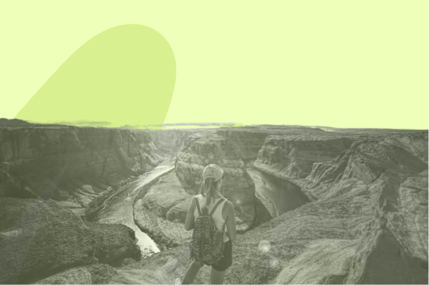 person standing over view of grand canyon