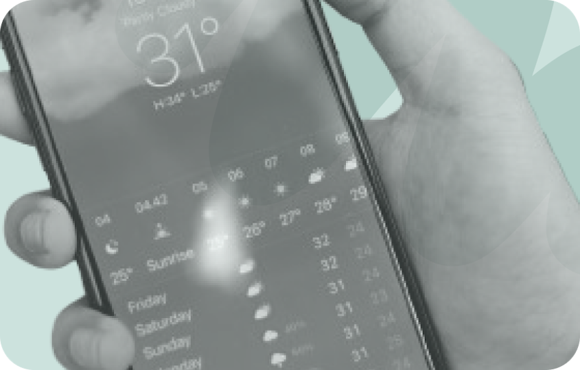 person holding phone with weather app