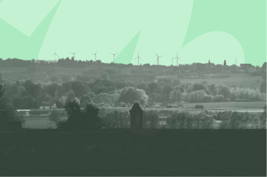 windmills in luscious and open green land