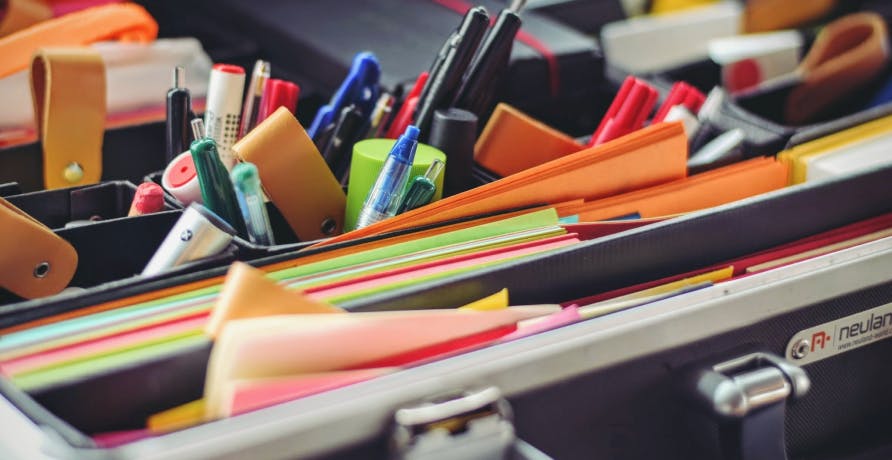 file cabinet with pens and paper