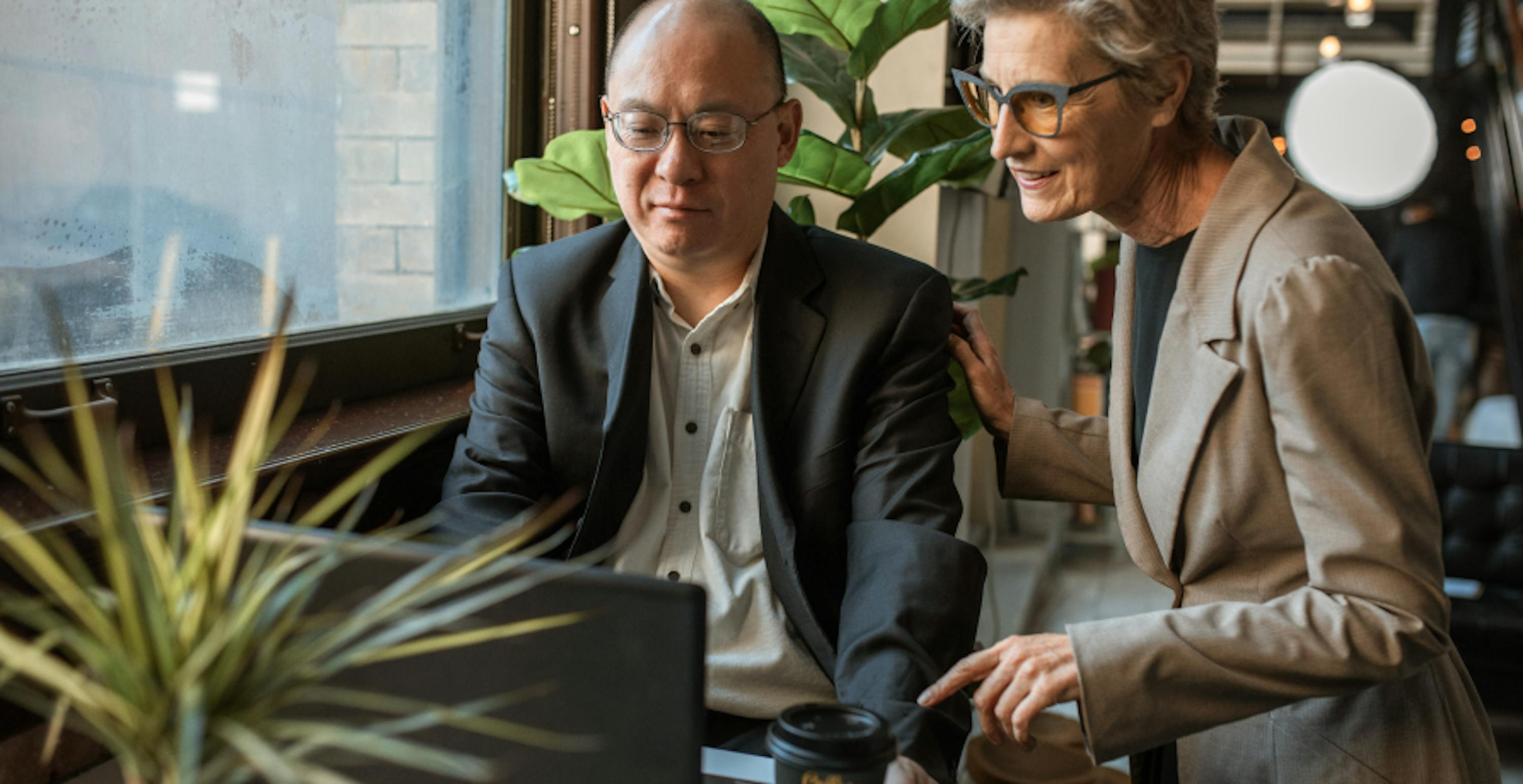 colleagues looking at computer screen