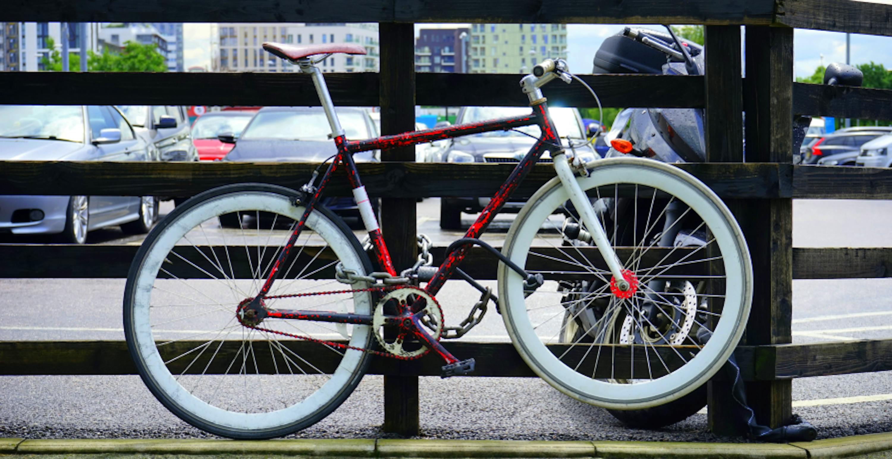 bike placed against gate