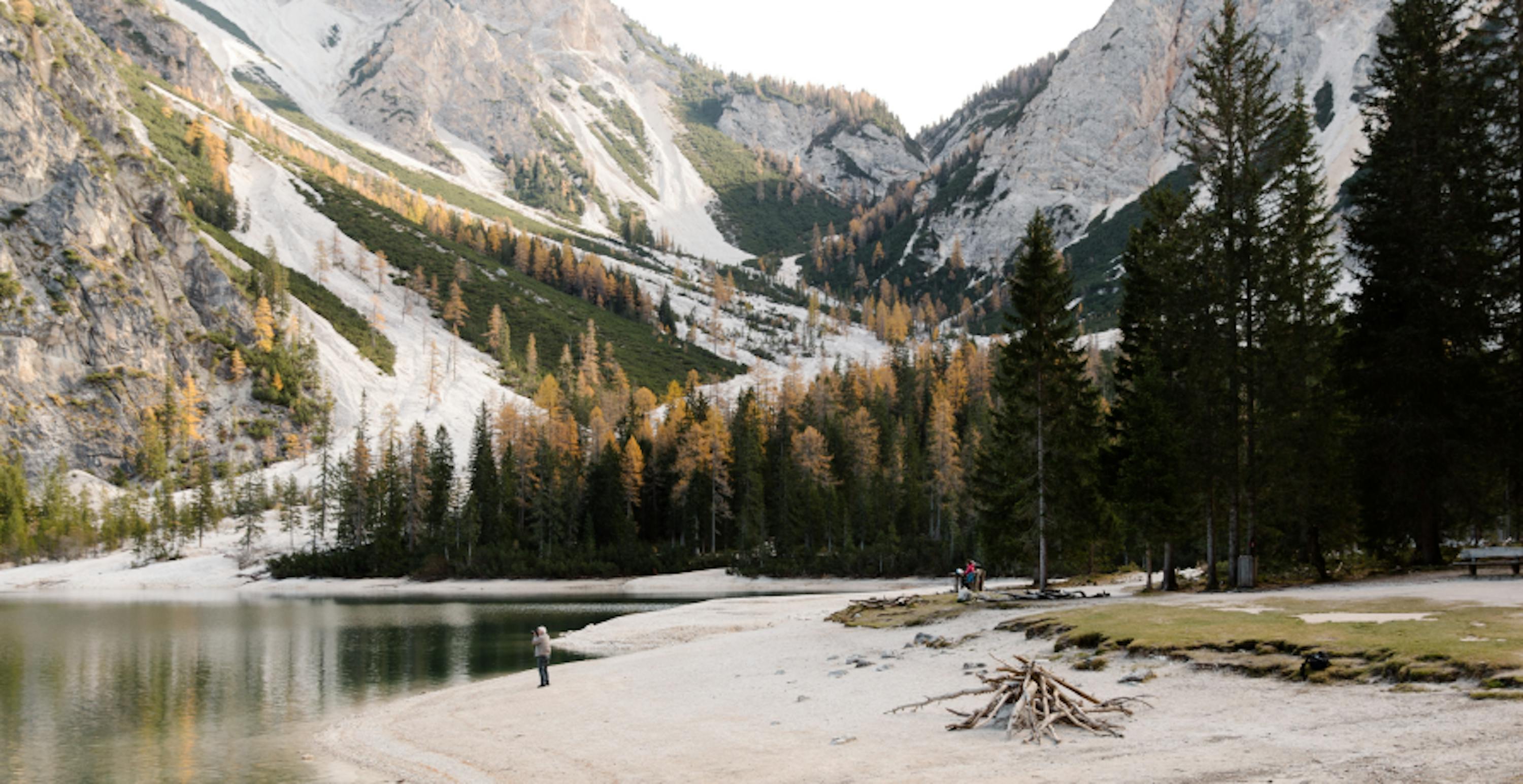 view of snowy mountains and lake late fall