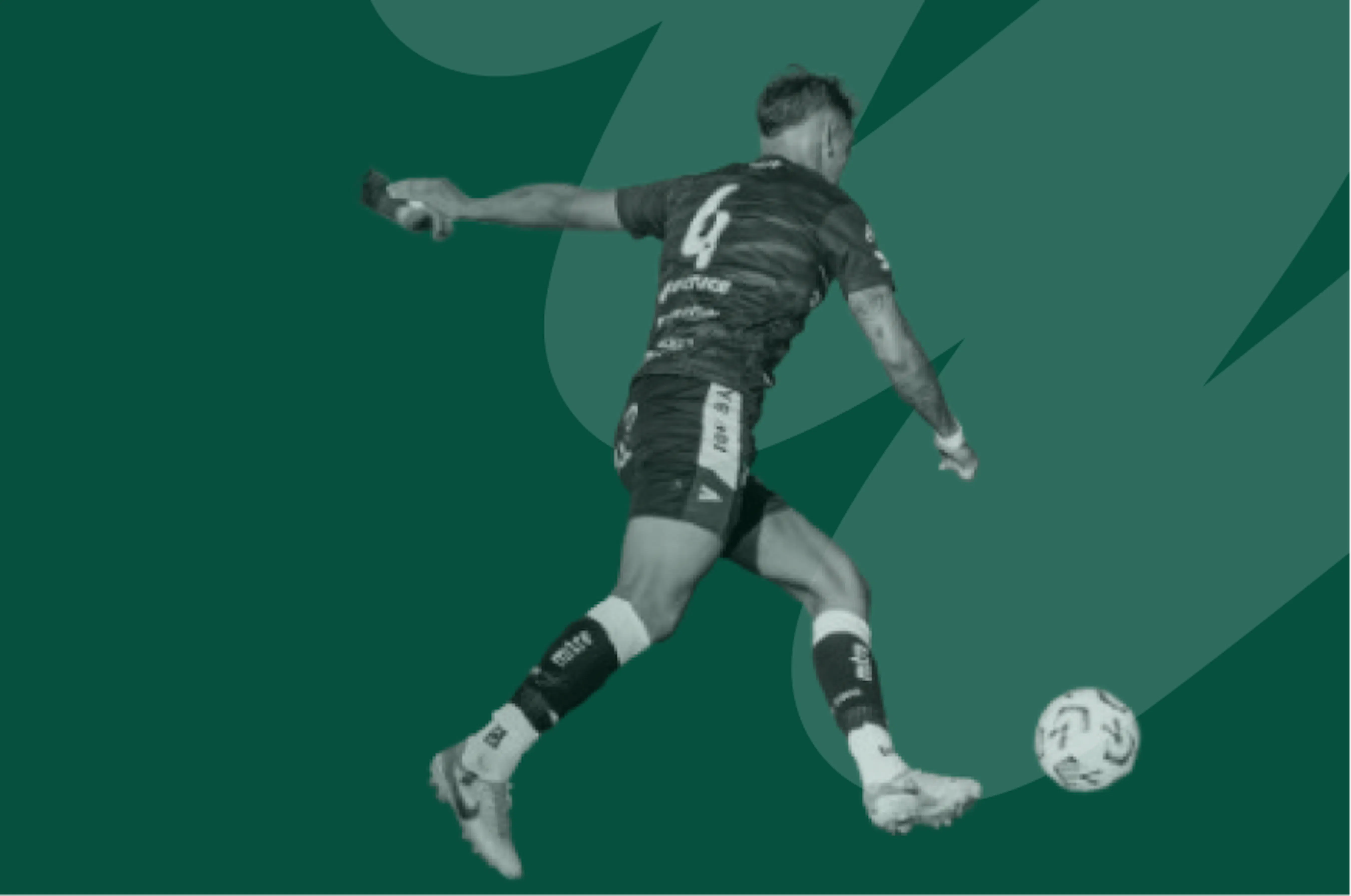 footballer kicking ball