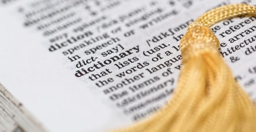 dictionary definition with gold tassle