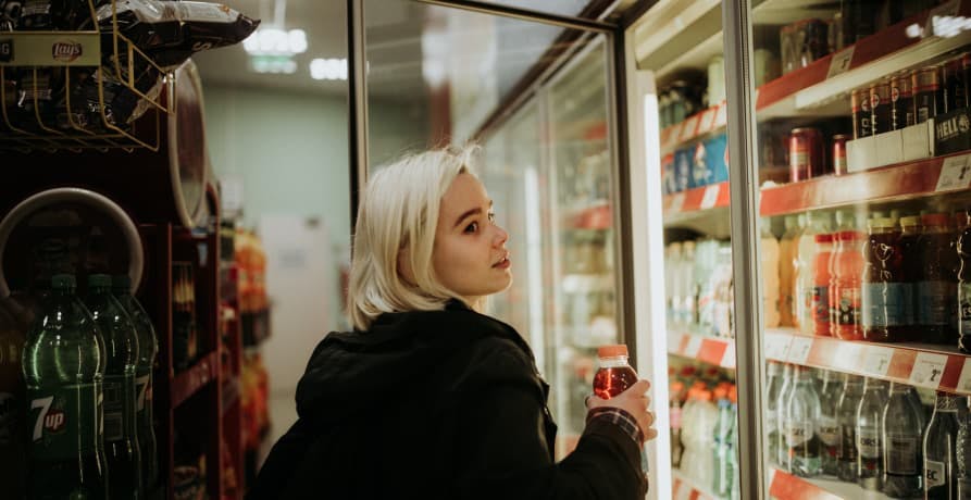 woman looking at refrigerated section