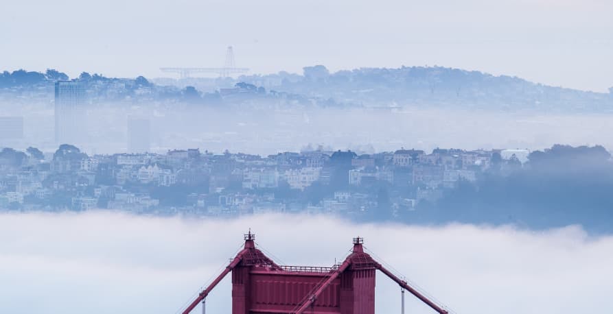 view of san francisco above golden gate bridge foggy